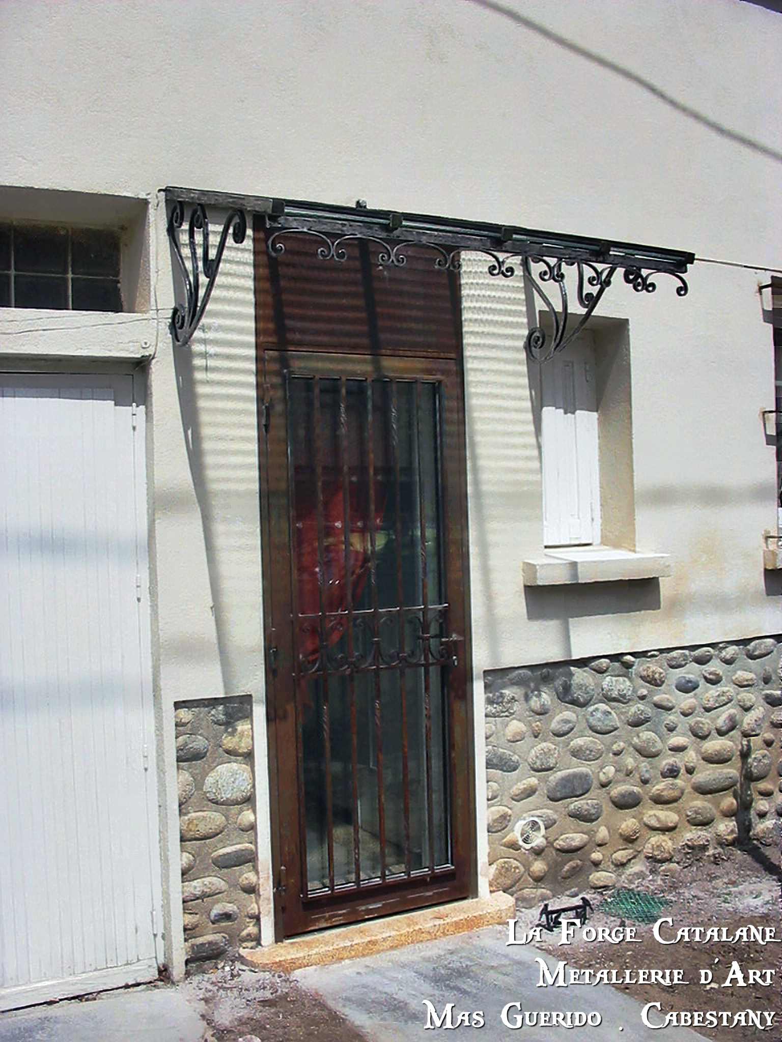 Marquise fer classique et volutes  Forge Catalane.jpg